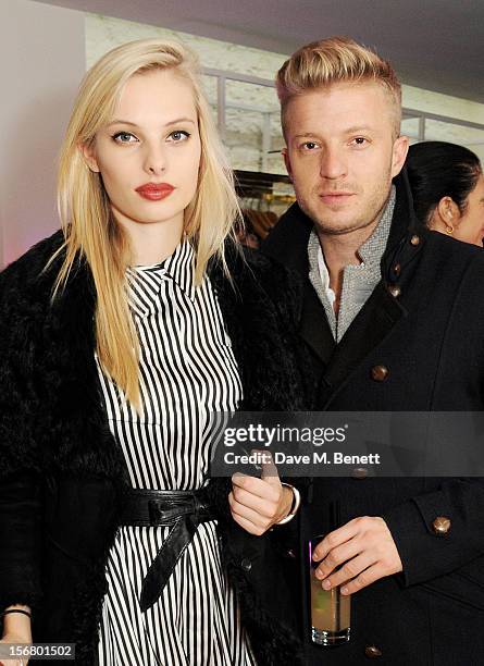 Model Dioni Tabbers and Josh Varney attend the launch of the SuperTrash London flagship store on November 21, 2012 in London, England.