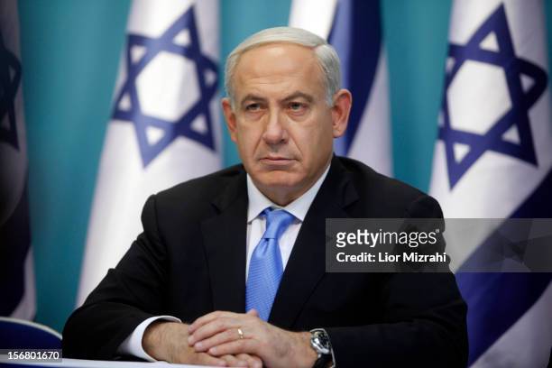 Prime Minister Benjamin Netanyahu looks on during a joint press conference with Foreign Minister Avigdor Liberman and Defence Minister Ehud Barak ,...