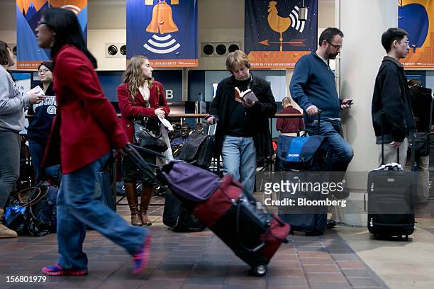 Travelers wait to board an Amtrak train at Union Station in Washington, D.C., U.S., on Wednesday, Nov. 21, 2012. U.S. Travel during the Thanksgiving...