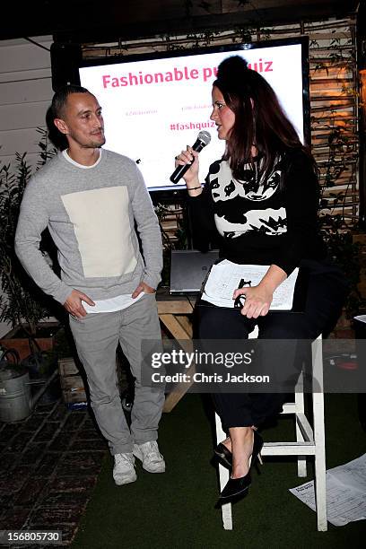 Richard Nicoll speaks with Quizmaster Rebecca Ward hosts the Vodafone Fashionable Pub Quiz at Shoreditch House on November 21, 2012 in London, United...