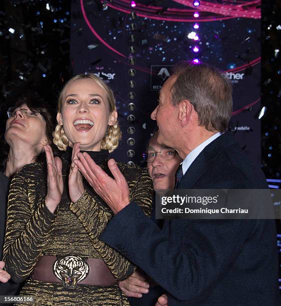 Diane Kruger and Mayor of Paris Bertrand Delanoe attend the switching on of the Christmas lights along the Champs Elysees on November 21, 2012 in...