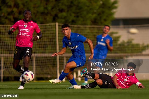 Carles Alena of Getafe CF battle for the ball with Lorenzo Faravelli of Independiente del Valle during Pre-Season Friendly match between Getafe CF...