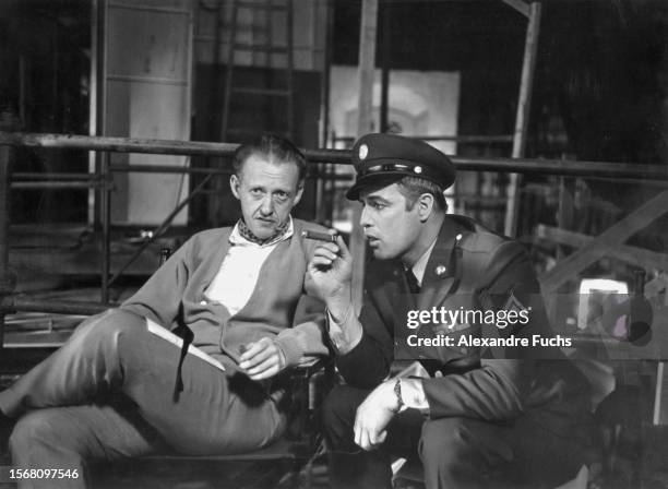 Writer Stanley Shapiro with actor Marlon Brando at the set of the film 'Bedtime Story' in 1963