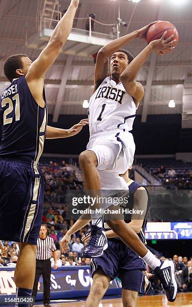 Cameron Biedscheid of the Notre Dame Fighting Irish shoots the ball as Kevin Larsen of the George Washington Colonials defends at Purcel Pavilion on...