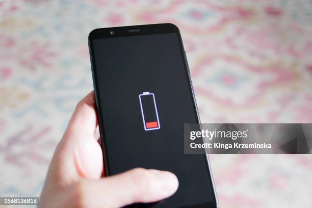 phone battery low - using a mobile phone stock pictures, royalty-free photos & images