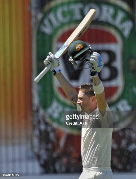 Australia's batsman Michael Clarke celebrates his 100 runs against South Africa on the first day of the second cricket Test match at the Adelaide...