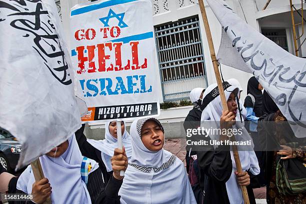 Muslim activists from Hizbut Tahrir Indonesia protest during against the Israel and US governments as against Israeli air strikes on the Gaza Strip...