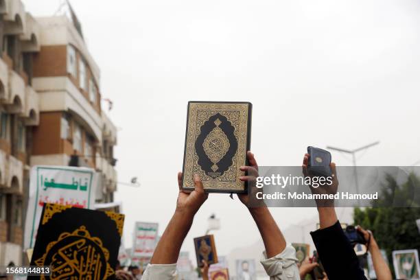 Yemenis participate in a protest denouncing the burning of Islam’s holy book, the Quran, in Sweden and Denmark, on July 24, 2023 in Sana'a, Yemen....
