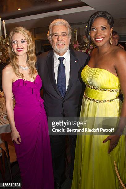 Tenor/conductor Placido Domingo poses with soprano Angel Blue and guest as they attend Domingo's induction ceremony as Goodwill Ambassador of UNESCO...