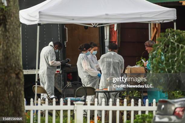 Massapequa Park, N.Y.: Evidence is removed from the home of Rex Heuermann, the suspected Gilgo Beach serial killer, in Massapequa Park, New York on...