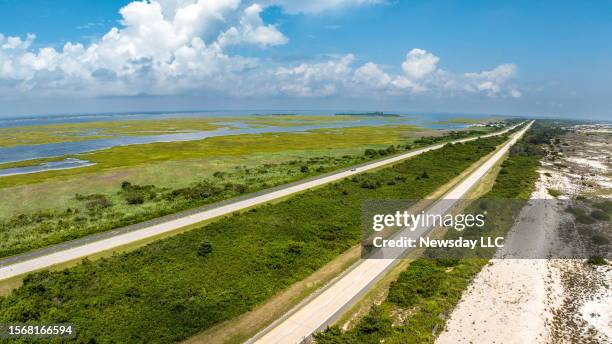 View on looking northeast on Ocean Parkway in Gilgo Beach, New York on July 21 the scene where victims of a suspected serial killer were discovered...