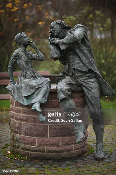 Bronze sculpture depicts a grandfather recounting a fairy tale to his dranddaughter on November 19, 2012 in Schoeneberg, Germany. Schoeneberg lies...