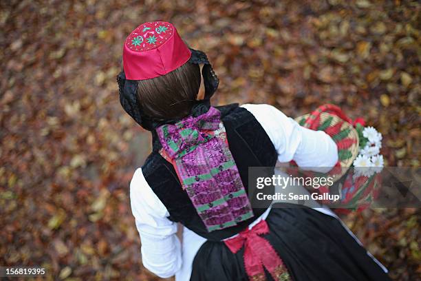 Little Red Riding Hood , actually actress Dorothee Weppler, wears the local Schwalm region folk dress with its red cap as she walks through a forest...