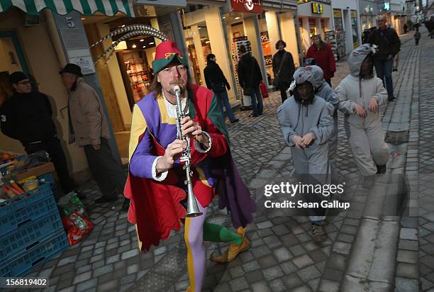 The Pied Piper of Hamelin, actually city tourism employee Michael Boyer, leads local children dressed as rats through a pedestrian shopping street on...