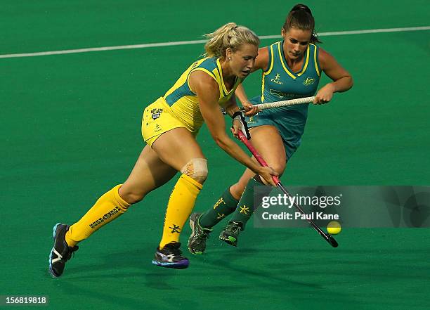 Casey Eastham of the Hockeyroos and Amelia Spence of the Jillaroos contest for the ball against during the womens Australia v Australia under 21 game...