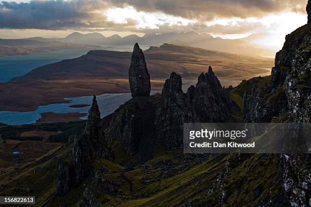 The sun sets over Basalt pinnacles known as 'The Old Man Of Storr,' that make up part of the Trotternish Peninsula and stand over the Sound of Raasay...