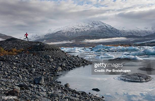 trail running by a glacier - knik glacier stock pictures, royalty-free photos & images