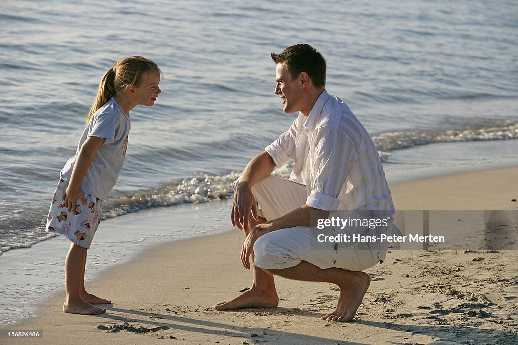 Father and daughter on the beach