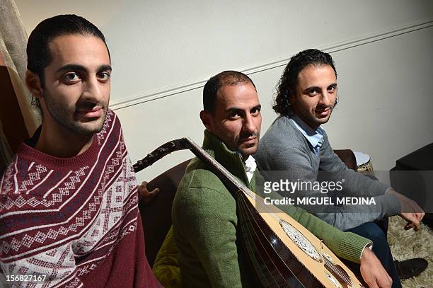 Brothers and members of the Palestinan oud band "Le Trio Joubran", Adnan, Samir and Wissam Joubran pose on November 22, 2012 in Paris. AFP PHOTO...