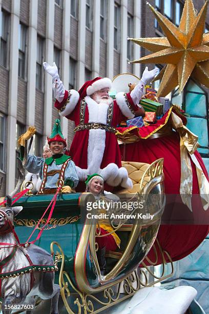 Man portraying Santa Claus waves to the crowd during the 86th Annual Macy's Thanksgiving Day Parade on November 22, 2012 in New York City. Macy's...