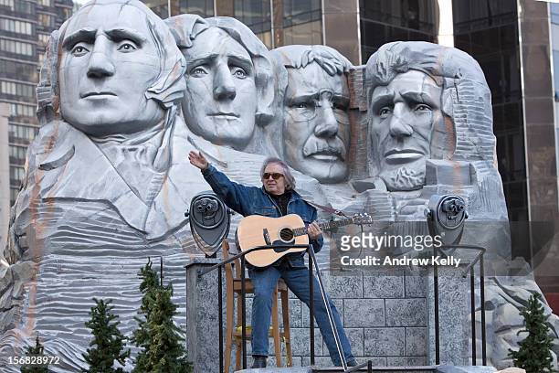 Singer Don McLean makes his way through Columbus Circle during the 86th Annual Macy's Thanksgiving Day Parade on November 22, 2012 in New York....