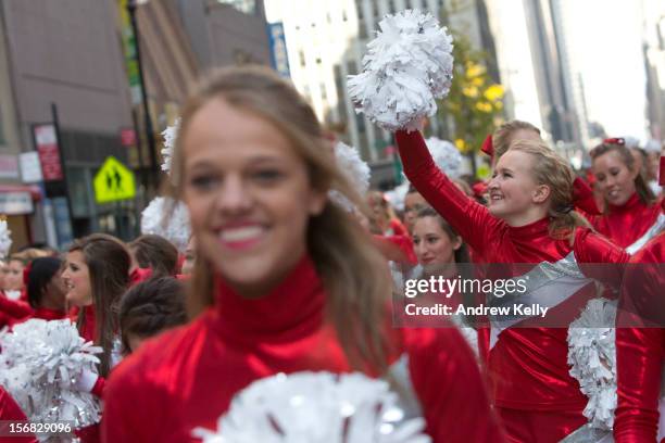 The Varsity Spirit Cheerleaders make their way down Sixth Avenue during the 86th Annual Macy's Thanksgiving Day Parade on November 22, 2012 in New...