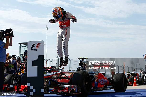 Lewis Hamilton of Great Britain and McLaren celebrates winning the United States Formula One Grand Prix at the Circuit of the Americas on November...