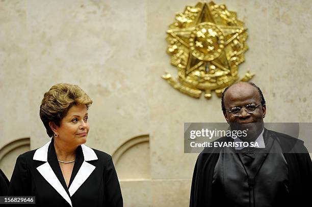 Brazilian President Dilma Rousseff and Minister Joaquim Barbosa shake hands during Barbosa's inauguration as President of the Supreme Court in...
