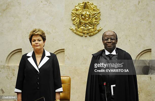 Brazilian President Dilma Rousseff stands next to Brazil judge Joaquim Barbosa during his inauguration as Brazil's first ever black head of the...