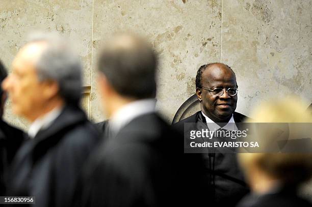 Brazil judge Joaquim Barbosa is pictured during his inauguration as Brazil's first ever black head of the Supreme Court, in a historic ceremony...