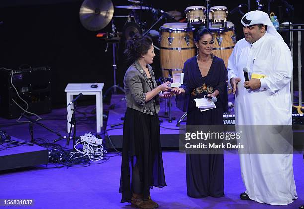 Hanan Abdalla recieves the Best Documentary Filmmaker award for In the Shadow of a Man from Shirin Neshat and Hafiz Ali Ali at the Awards Ceremony...