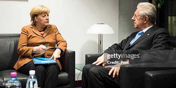 In this photo provided by the German Government Press Office , German Chancellor Angela Merklel holds talks with Italian Prime Minister Mario Monti,...