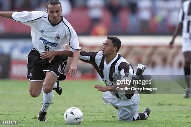 Rogerio of Corinthians and Dodo of Santos in action during the Corinthians and Santos Sao Paulo Championship semifinal match played at the Morumbi...