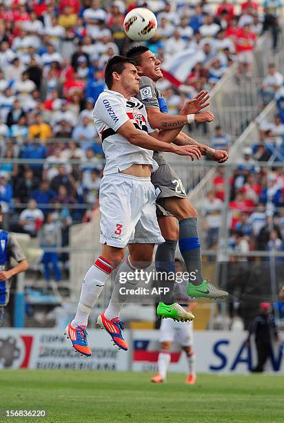 Kevin Harbottle of Chilean Universidad Catolica vies for the ball with Toloi of Brazilian Sao Paulo during their 2012 Copa Sudamericana first leg...