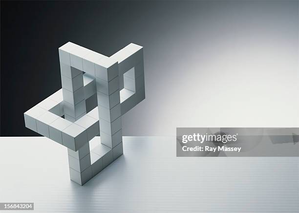 interlocking white cubes - illusione foto e immagini stock