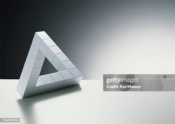 cubes forming triangle - optische illusion stock-fotos und bilder