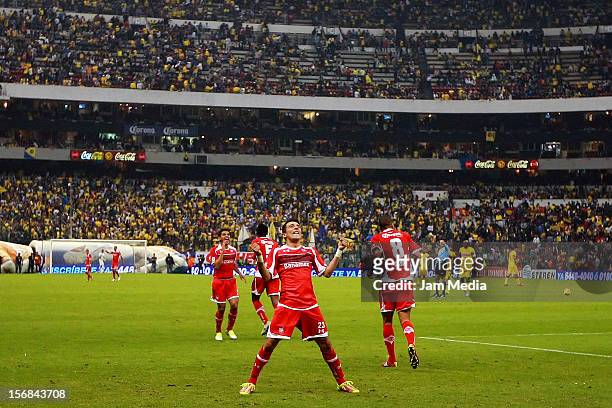 Edgar Benitez of Toluca celebrates a scored goal during a match against America as part of the semifinal Apertura 2012 Liga MX at Azteca Stadium on...