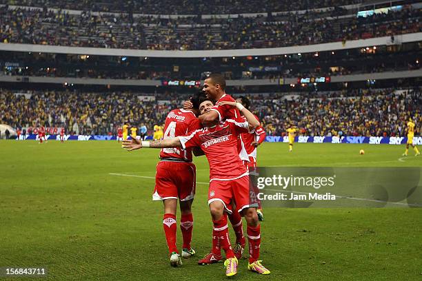 Edgar Benitez of Toluca celebrates a scored goal during a match against America as part of the semifinal Apertura 2012 Liga MX at Azteca Stadium on...