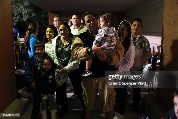 Shoppers wait to enter a Best Buy store on November 22, 2012 in Naples, Florida. Although controversial, many big retail stores have again decided to...