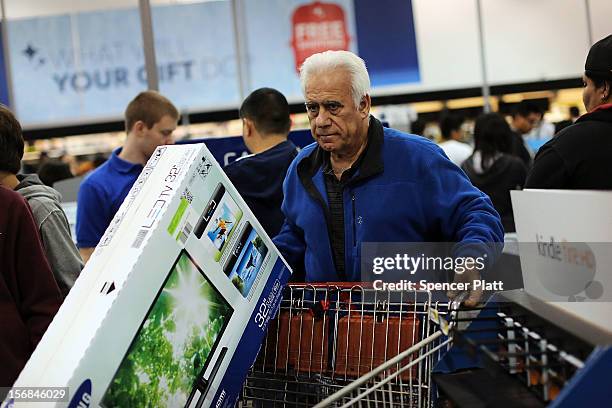 Shoppers move through a Best Buy store on November 23, 2012 in Naples, Florida. Although controversial, many big retail stores have again decided to...