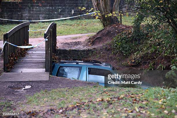 Car, in which a man died after being trapped in flood waters is wedged under a bridge near to a ford at Rectory Fields, in Chew Stoke, on November...