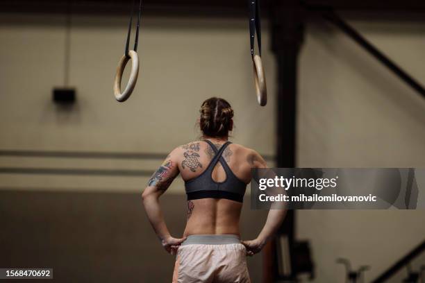 girl with tattoos in the gym - effort stock pictures, royalty-free photos & images