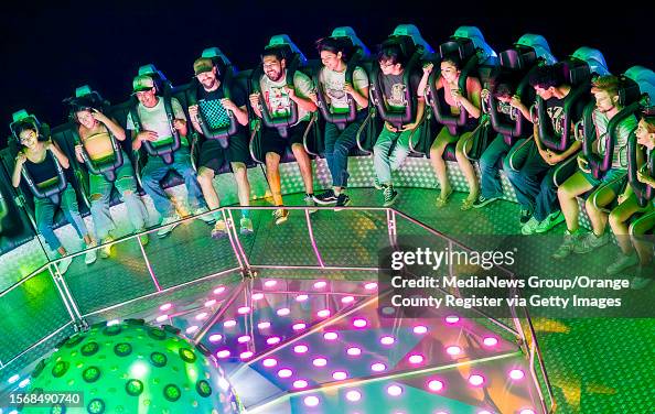 Moonwalker Fair Ride Fair goers enjoy a nighttime ride on the Moonraker carnival ride at ...