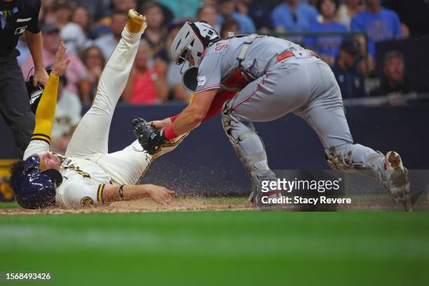 William Contreras of the Milwaukee Brewers is tagged out at home plate by Tyler Stephenson of the Cincinnati Reds during the third inning at American...