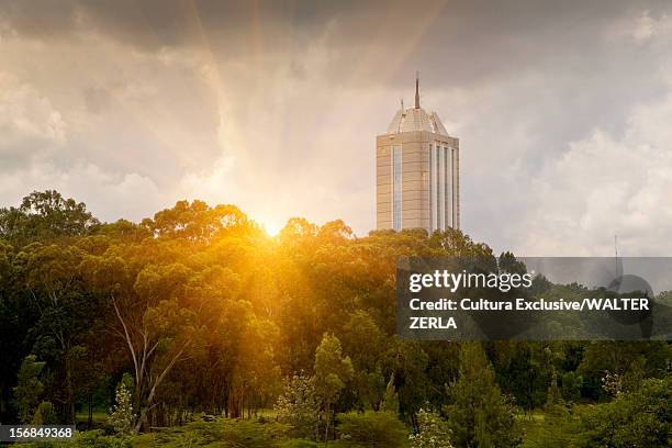 skyscraper overlooking rural landscape - nairobi building stock pictures, royalty-free photos & images