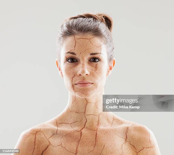 head and shoulders shot of woman with cracked skin - trockene haut stock-fotos und bilder