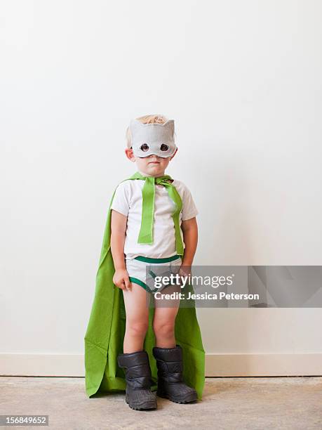studio shot, portrait of boy (2-3) wearing green cape and mask. - kids in undies stock pictures, royalty-free photos & images