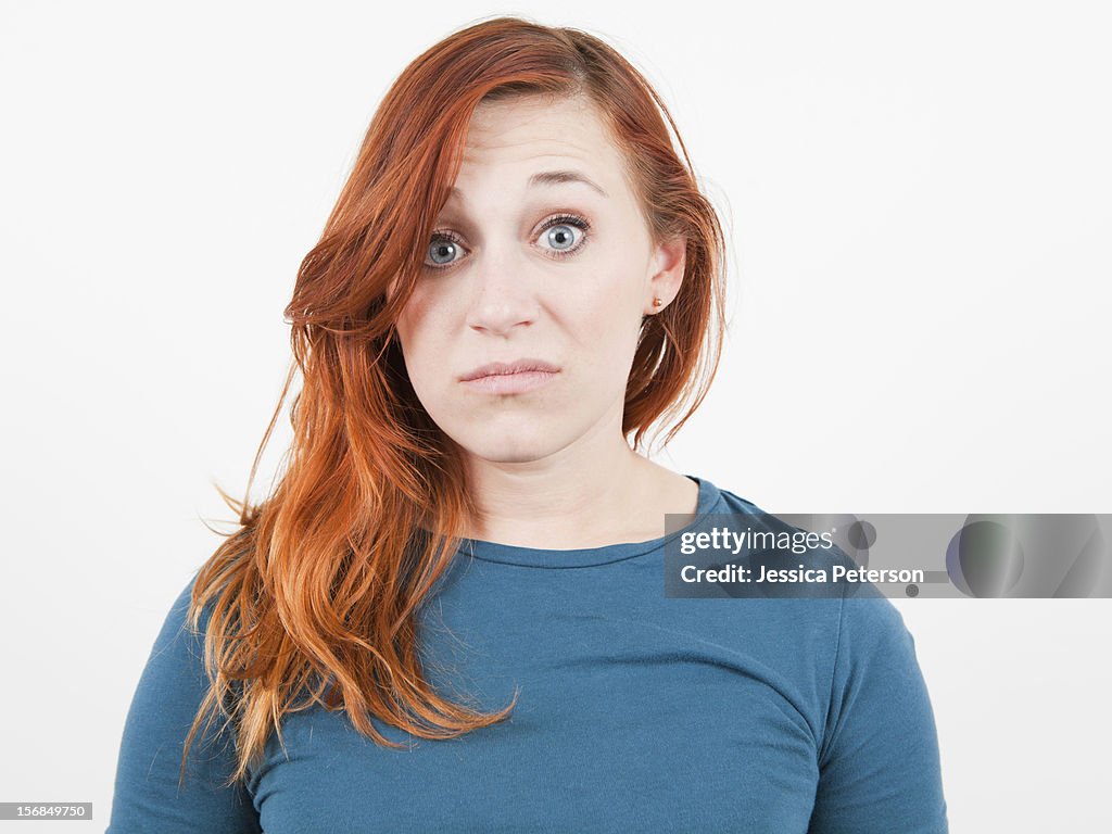 Studio Shot, Portrait of woman grimacing.