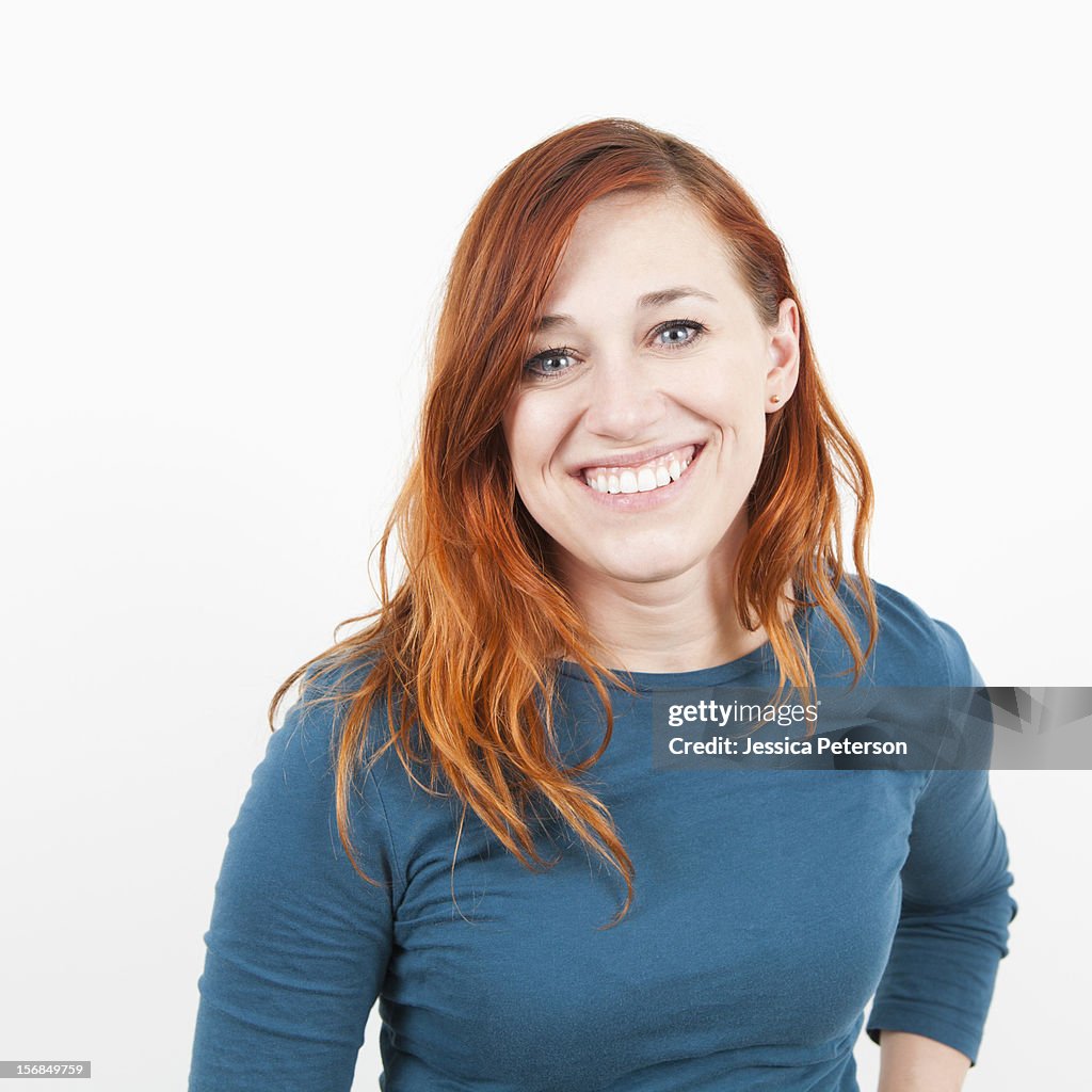 Studio shot, Portrait of smiling woman.
