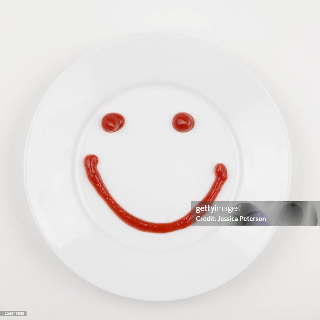 Plate with smiley face made of ketchup